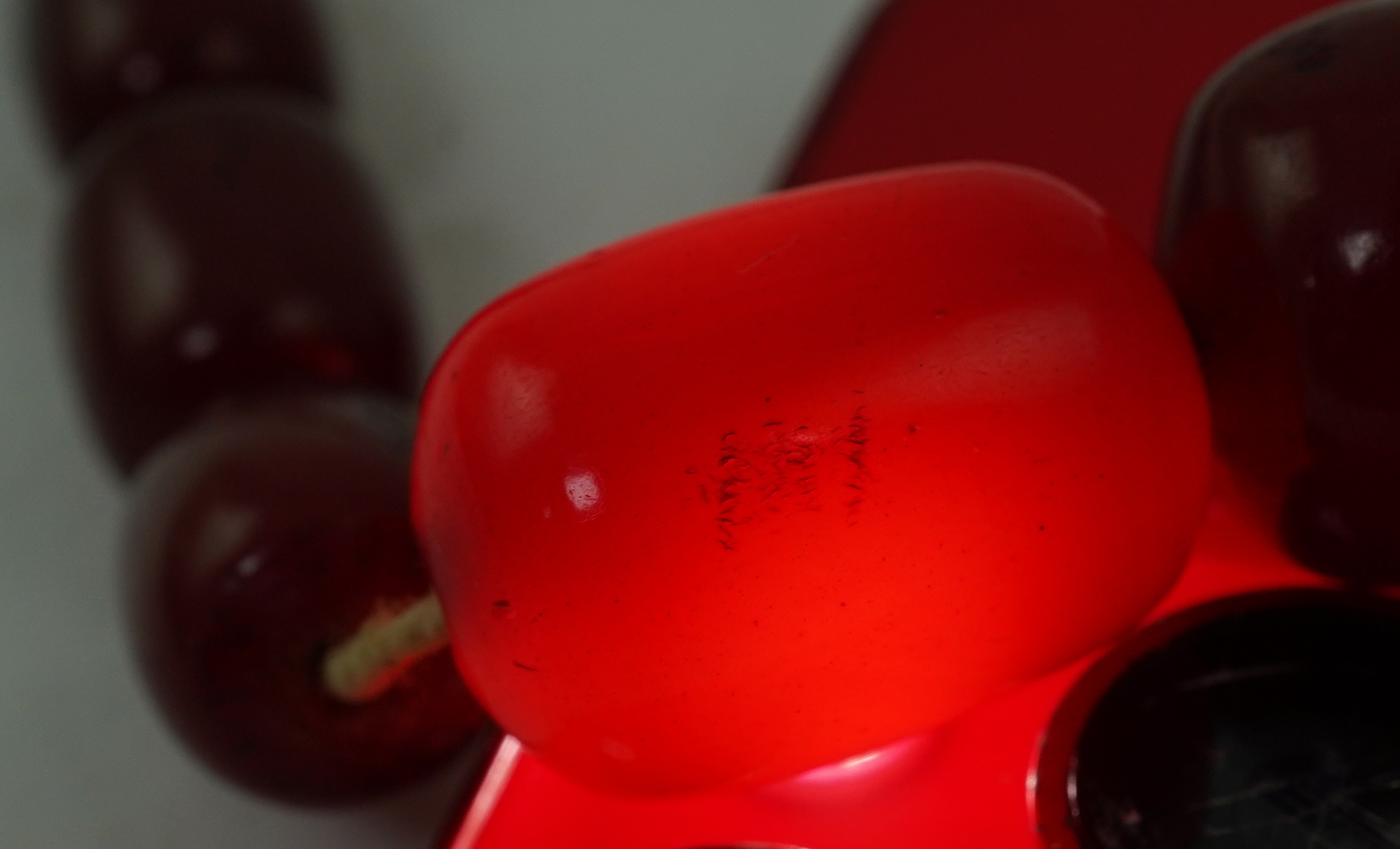 A cherry-coloured bakelite 'amber' necklace